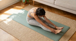All You Need Is This Simple Yoga Pose To Ease Tight Hips—and You Can Do It From Your Bed